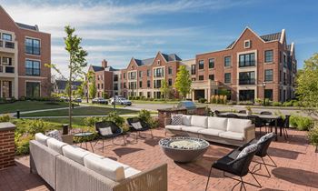 Outdoor lounge with fire pit and grilling stations